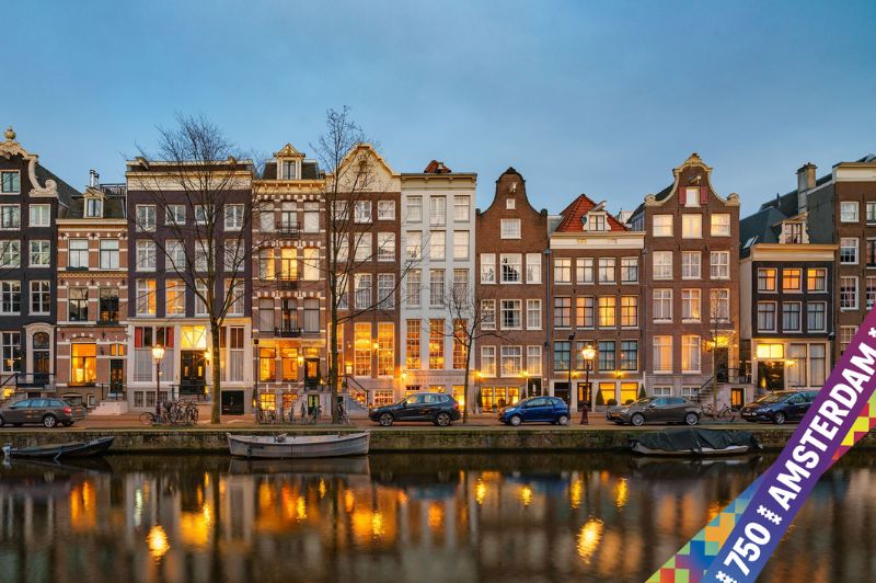 Facade of the ambassade hotel in amsterdam with a ‘750 years amsterdam’ sticker celebrating the city’s anniversary.