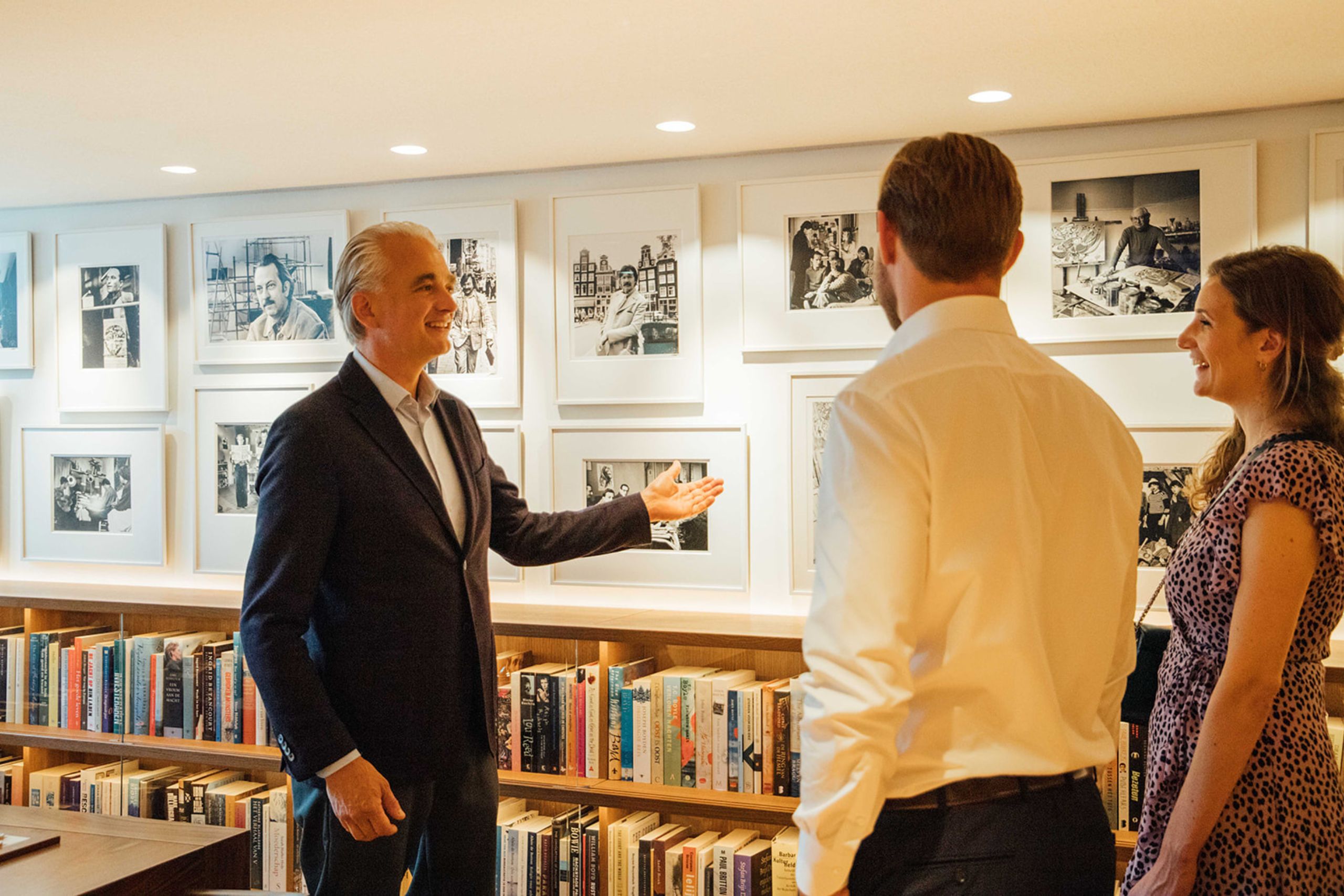 Eduard janssen guiding a private art tour at the ambassade hotel in amsterdam, sharing insights into the collection.