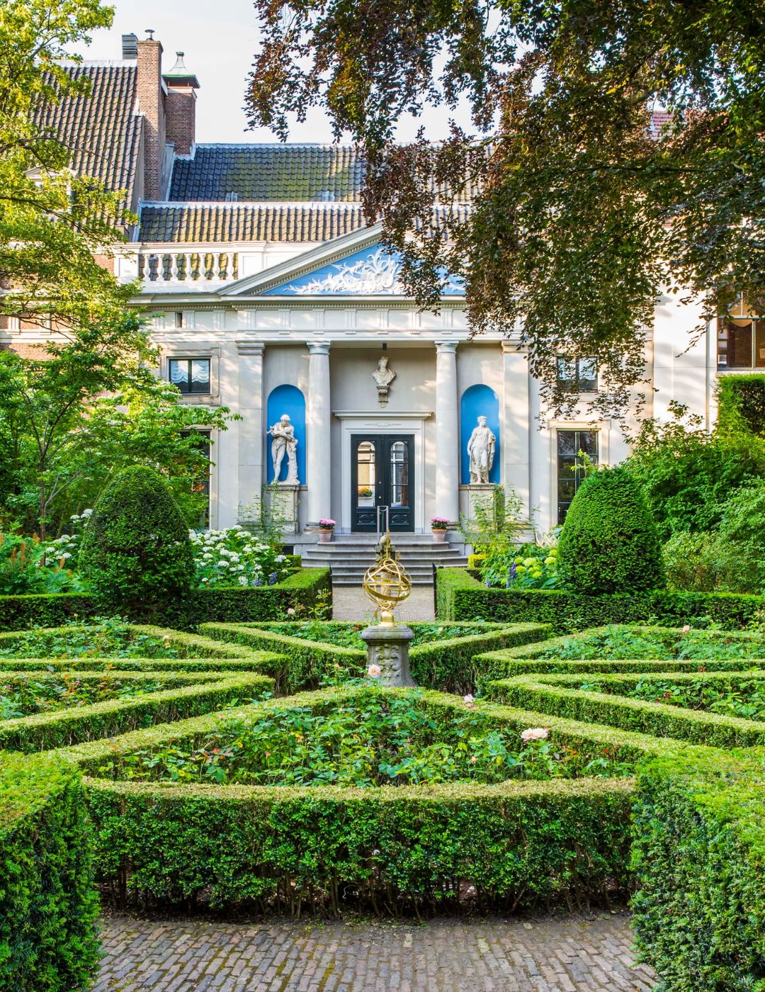 Exterior view of museum van loon in amsterdam with classic canal house architecture.