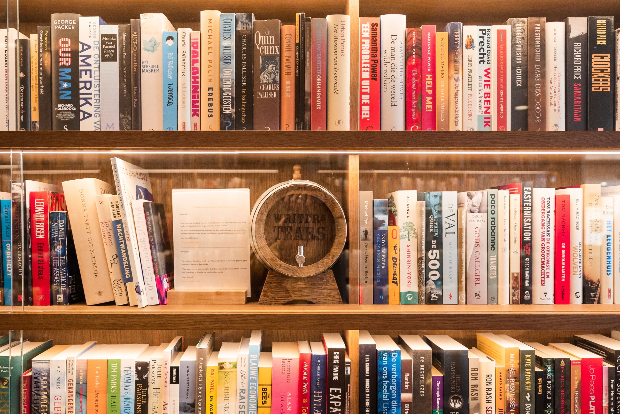 Over 5,000 signed books by authors who stayed at the ambassade hotel, displayed in the unique library bar.