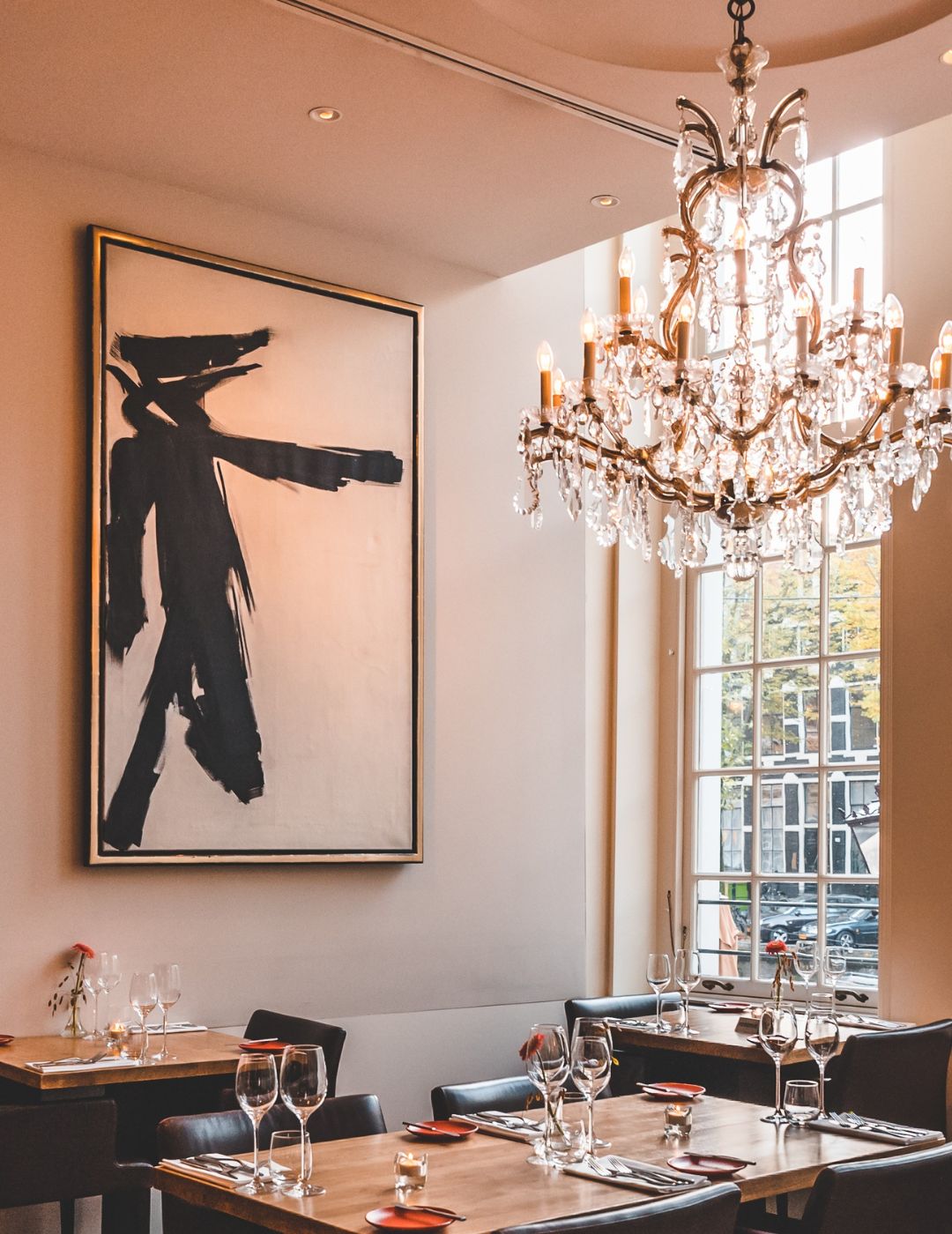 Dining along the canal with artworks on the walls at brasserie ambassade.