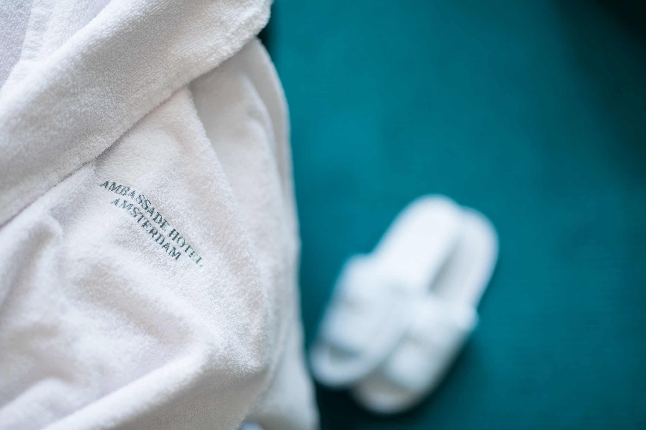 Soft bathrobe and slippers at the ambassade hotel in amsterdam, offering comfort and luxury in every detail.