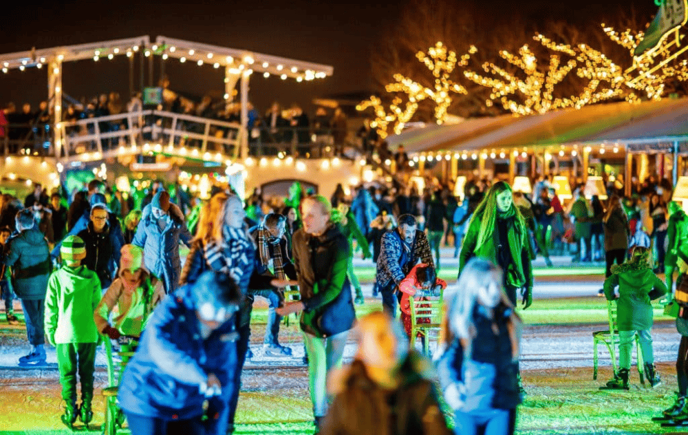 Ice skating at museumplein in amsterdam, with views of the rijksmuseum and a festive winter atmosphere.