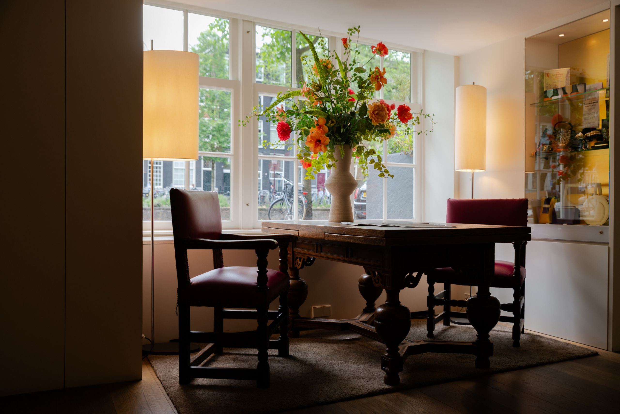 Newspaper table in the ambassade hotel lobby, offering a selection of dutch daily papers for guests.