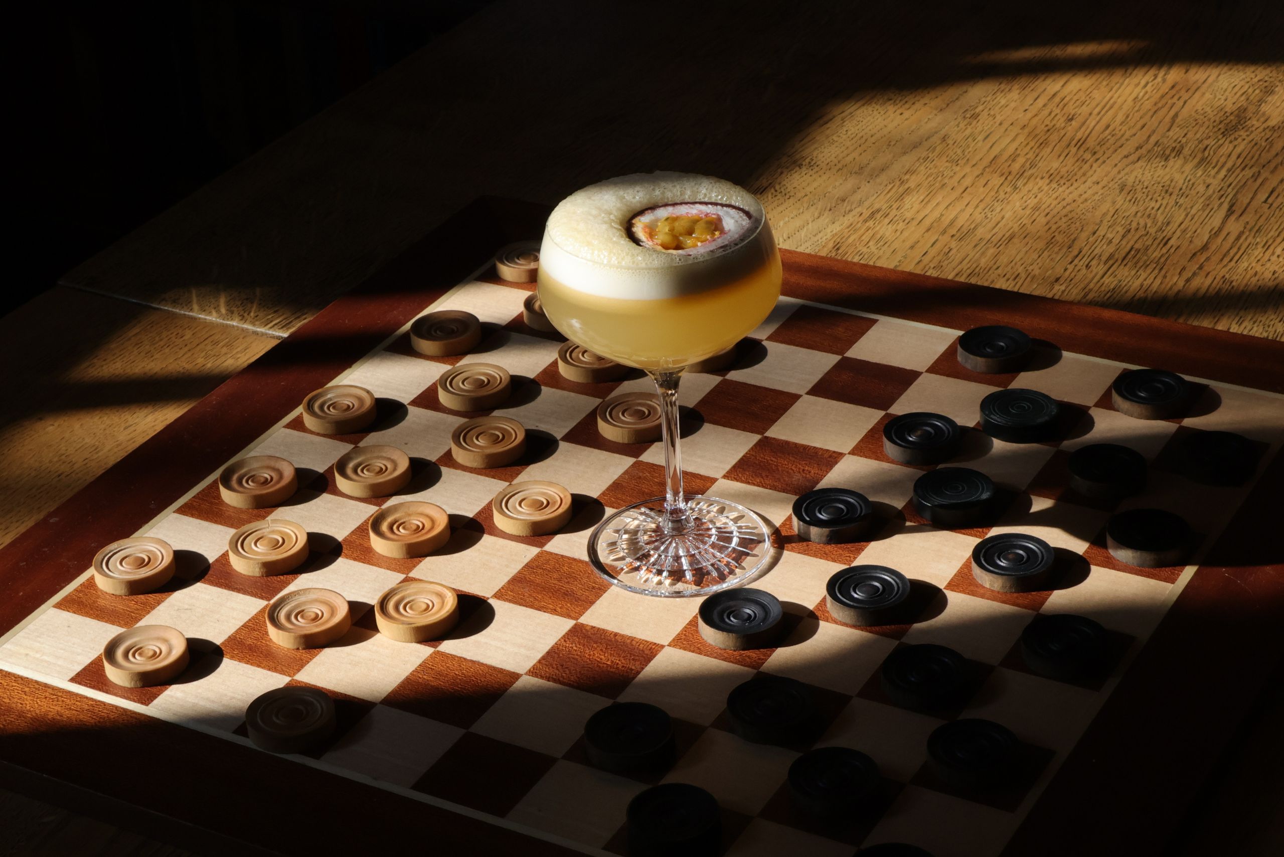 Elegant pornstar martini cocktail served at the library bar, with passionfruit garnish and refined presentation.