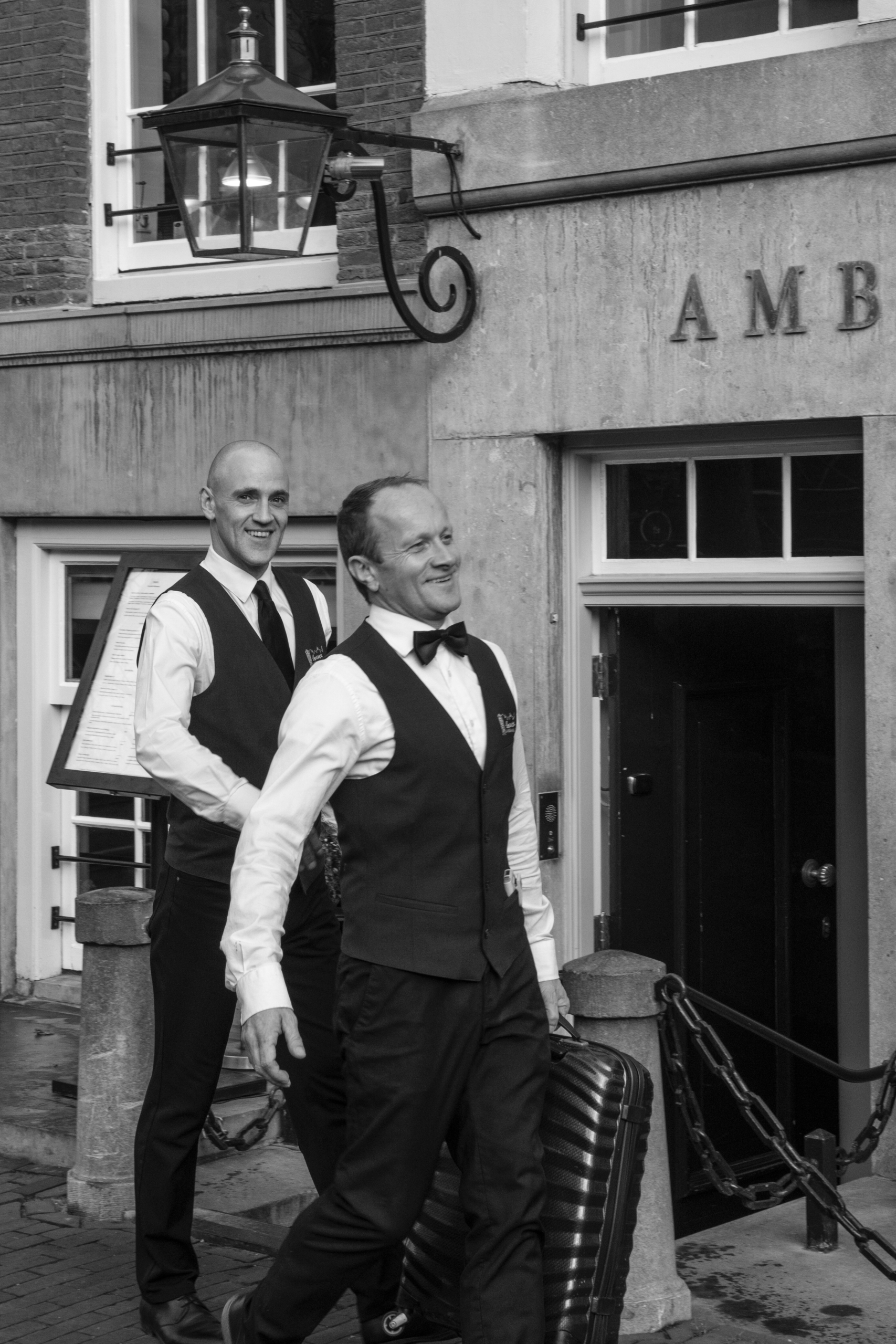 The front office assistants of the ambassade hotel, welcoming guests and assisting with luggage and personalized service.