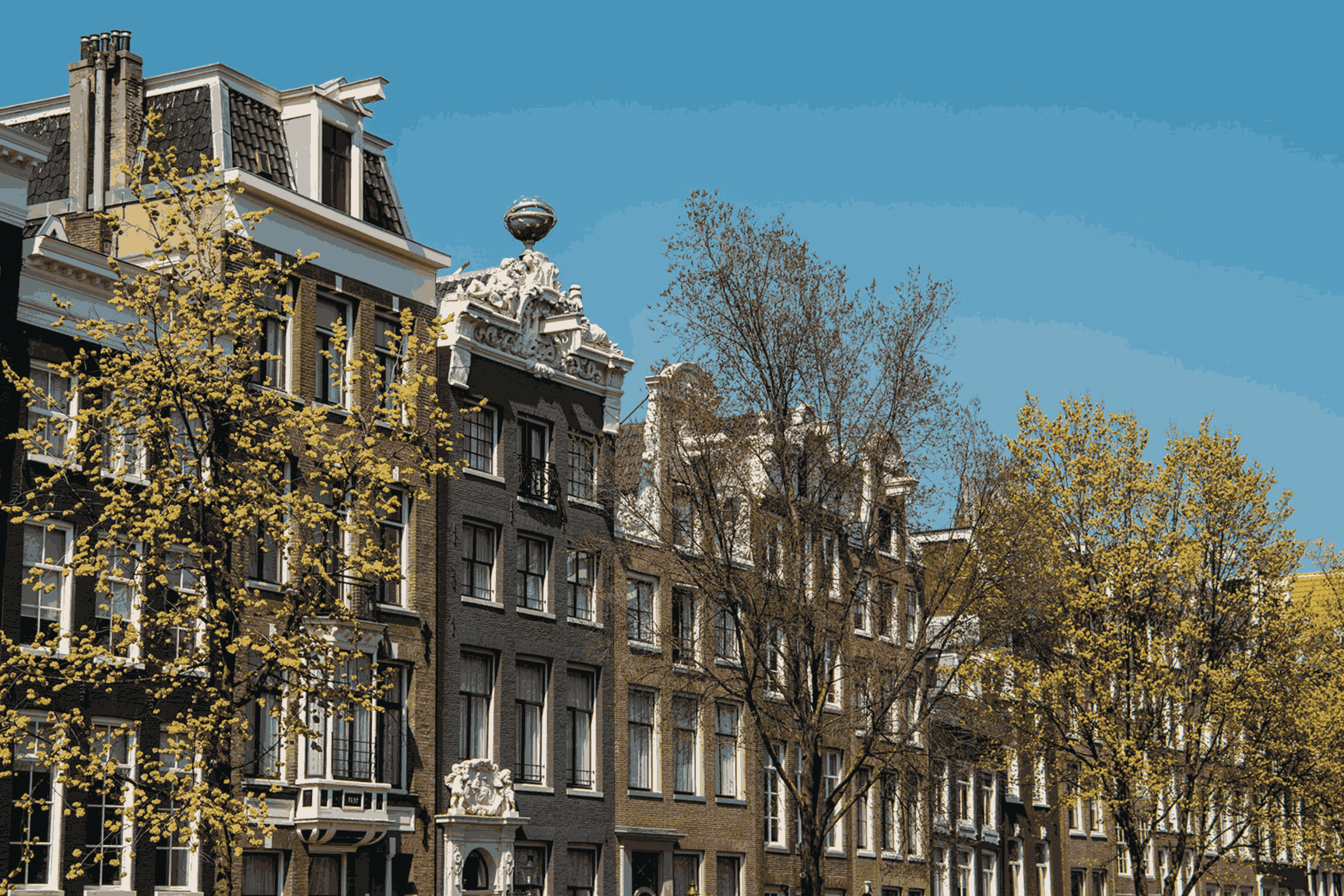 Historic canal houses on the herengracht in amsterdam, home to the ambassade hotel.